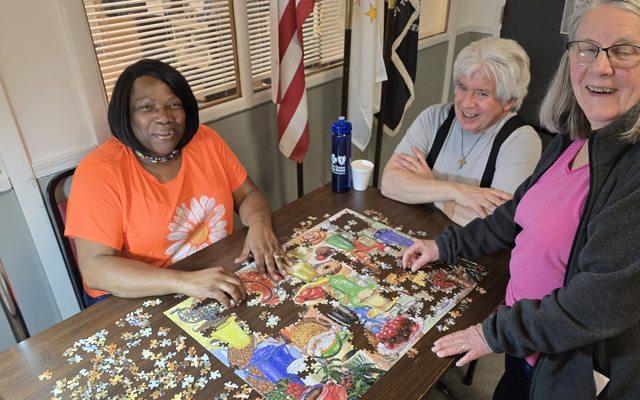 Members playing cards and board games